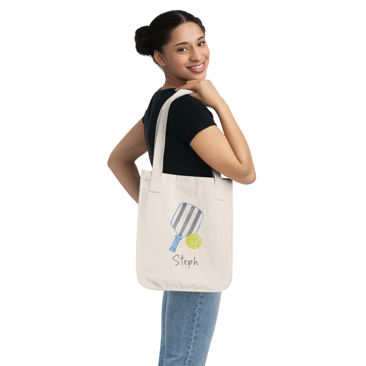 Pickleball player's personalized tote bag. An organic cotton canvas tote bag with a printed illustration of a striped pickleball paddle and a yellow pickleball, with customizable text written below, such as "Smash it!". Custom and personalized tote.